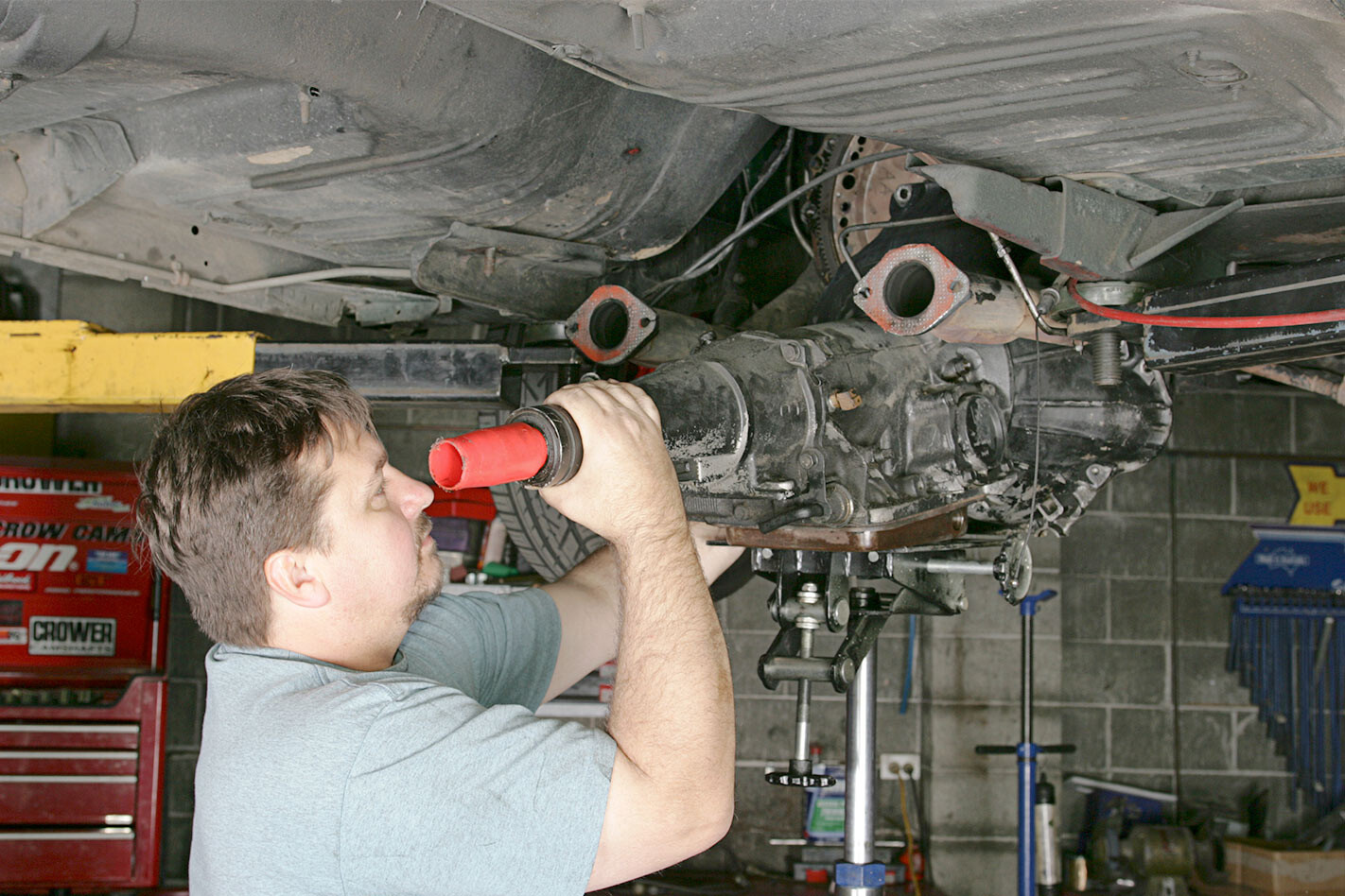 disconnect the battery, drop the exhaust and tailshaft
