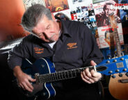 John Evans playing guitar